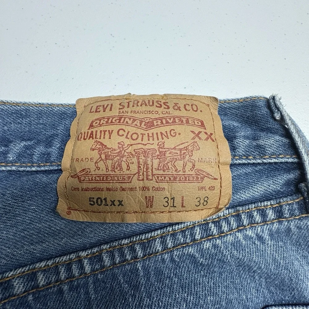 Levi's 501xx Series Medium Wash Distressed Straight Fit Button Fly Jeans red tag
